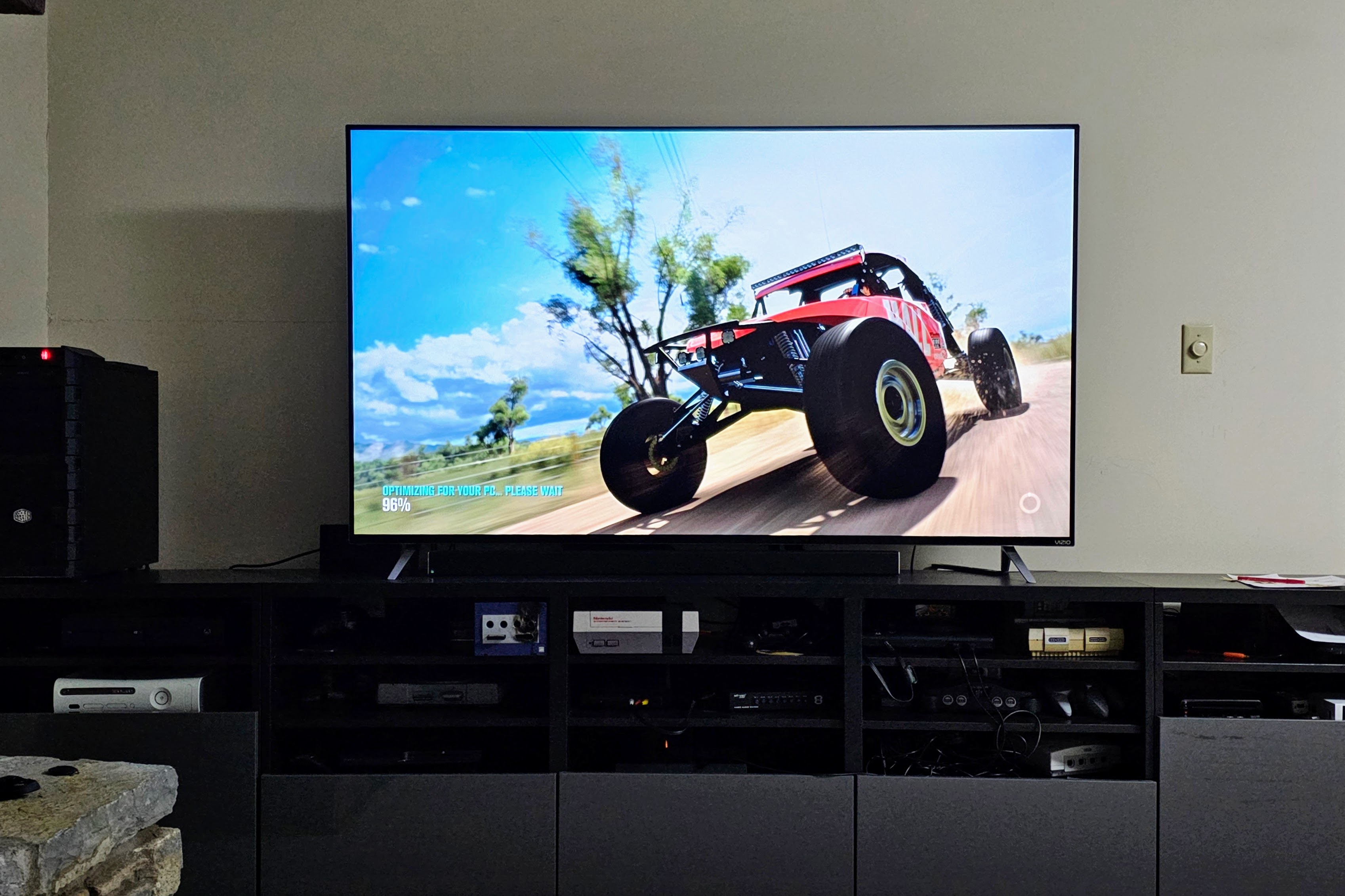 70-inch TV playing Forza Horizon 3 off a desktop tower PC in an entertainment console.