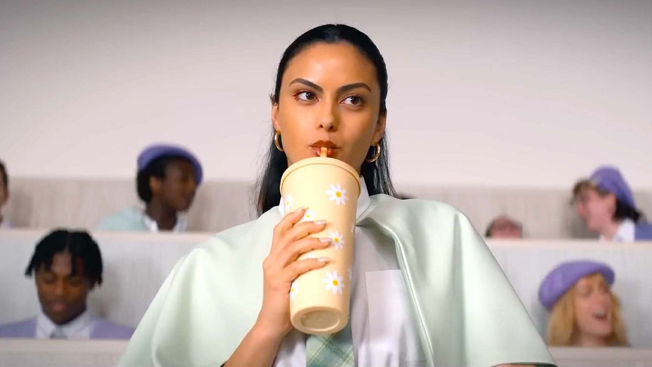Camila Mendes as Drea drinking from a plastic cup in Do Revenge.