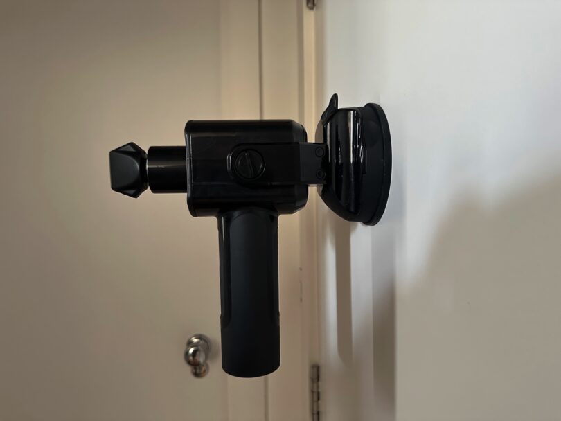 Someone made a wall-mounted massage gun